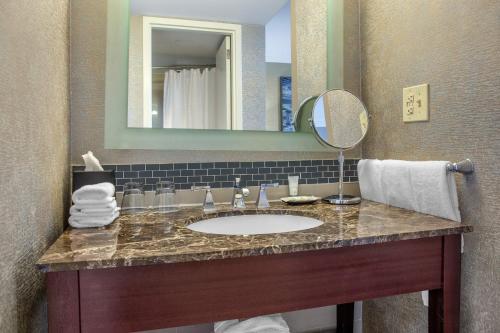 a bathroom with a sink and a mirror at The Westin Fort Lauderdale in Fort Lauderdale
