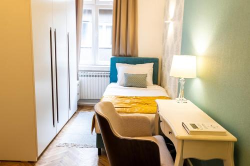 Postel nebo postele na pokoji v ubytování Luxury Suite / Karlo Paržik