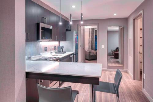 a kitchen with a sink and a counter top at Residence Inn by Marriott Weehawken in Weehawken