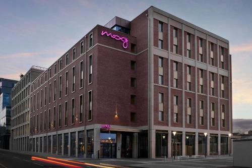 a building with a sign on the side of it at Moxy Edinburgh Fountainbridge in Edinburgh