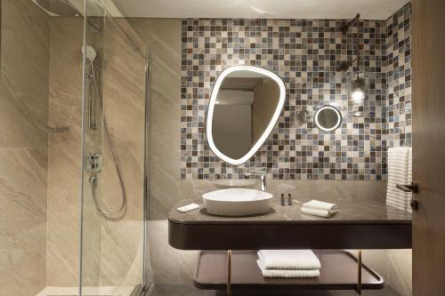 a bathroom with a sink and a shower at The Westin Istanbul Nisantasi in Istanbul