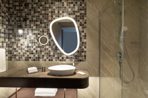 a bathroom with a sink and a mirror at The Westin Istanbul Nisantasi in Istanbul