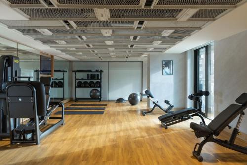 a gym with treadmills and elliptical machines at The Westin Istanbul Nisantasi in Istanbul