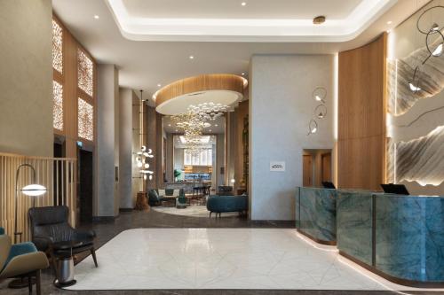 a lobby of a hotel with a reception desk at The Westin Istanbul Nisantasi in Istanbul