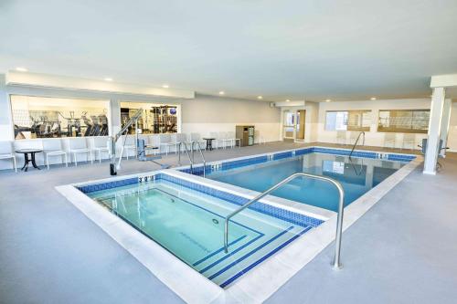 a large swimming pool in the middle of a building at SpringHill Suites by Marriott Colorado Springs Downtown in Colorado Springs