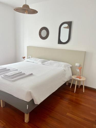 A bed or beds in a room at terrazza e giardino apartment