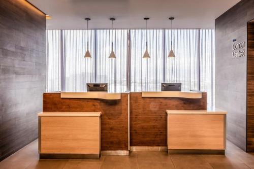 a lobby with two desks and a window at Fairfield Inn & Suites by Marriott Mexico City Vallejo in Mexico City