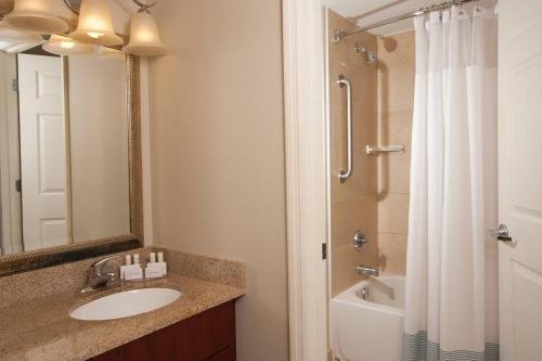a bathroom with a sink and a shower at TownePlace Suites The Villages in The Villages