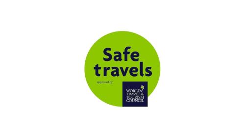 a green tag with safe travels written on it at Fuchsia Lodge - New Luxury 5* Beachside Lodge with Sauna - 4 beds ensuite - Spectacular Location in Waterville