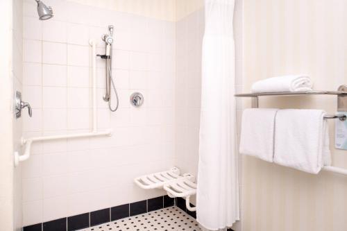 a bathroom with a shower with white towels at Fairfield Inn and Suites by Marriott San Antonio Northeast / Schertz / RAFB in Schertz