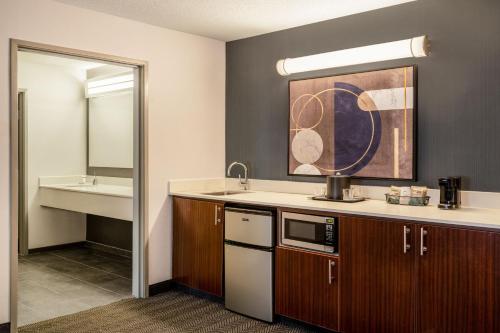 a small kitchen with a sink and a sink at Courtyard by Marriott Colorado Springs South in Colorado Springs
