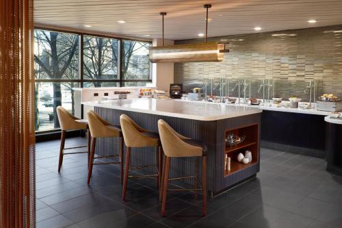 a kitchen with a large island with bar stools at Chattanooga Marriott Downtown in Chattanooga