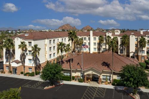 an aerial view of a hotel with palm trees at Residence Inn by Marriott Phoenix Airport in Phoenix