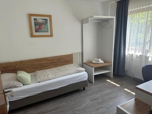 Una cama o camas en una habitación de Hotel Rennekamp