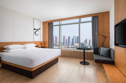 Postel nebo postele na pokoji v ubytování Fairfield by Marriott Foshan Nanhai