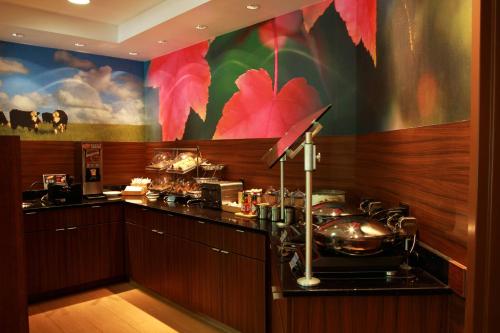 a kitchen with a counter with pots and pans at Spark By Hilton Traverse City in Traverse City