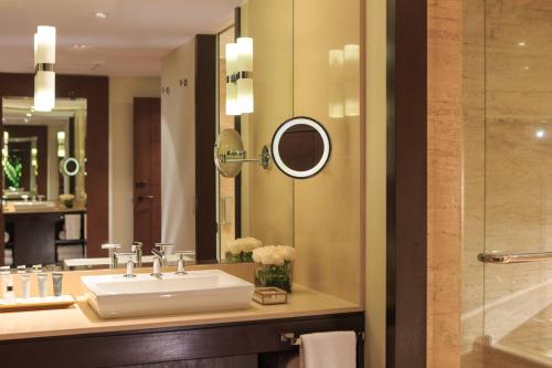 a bathroom with a sink and a mirror at JW Marriott El Convento Cusco in Cusco