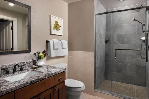 a bathroom with a shower and a toilet and a sink at Marriott's MountainSide in Park City