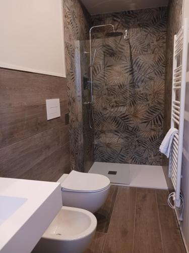 a bathroom with a toilet and a shower at MR Living Bed & Breakfast in Boiano