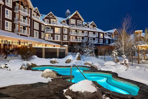 a resort with a swimming pool in the snow at The Westin Trillium House, Blue Mountain in Blue Mountains