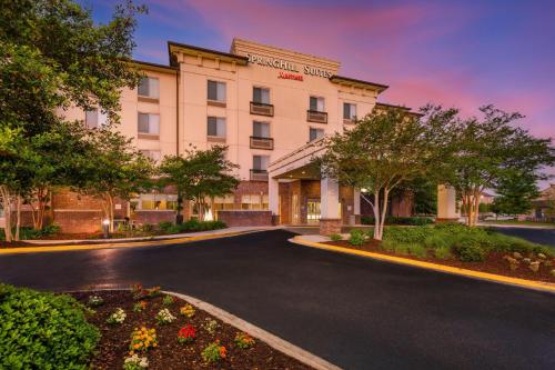 a rendering of a hotel building with a driveway at SpringHill Suites by Marriott Lafayette South at River Ranch in Lafayette