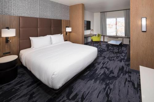 a hotel room with a large bed and a desk at Fairfield Inn & Suites by Marriott Oklahoma City Downtown in Oklahoma City