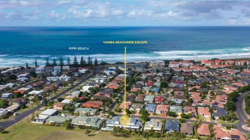 an aerial view of a suburb next to the ocean at Yamba Beachside Escape - oceanstays in Yamba