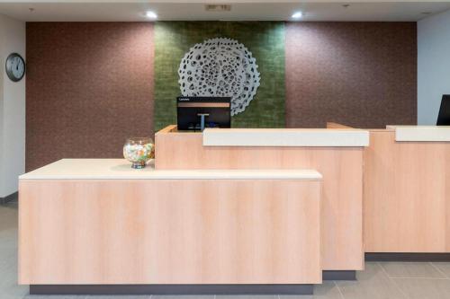 a lobby with a reception desk with a vase on it at Fairfield Inn & Suites Bend Downtown in Bend