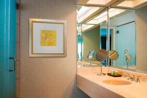 a bathroom with a sink and a mirror at The Westin Pittsburgh in Pittsburgh