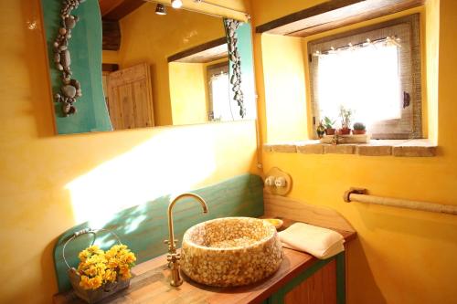 a bathroom with a sink and a mirror at Luxury villa Colle dell'Asinello ,proprietari ,Villa In esclusiva near ORVIETO in Guardea