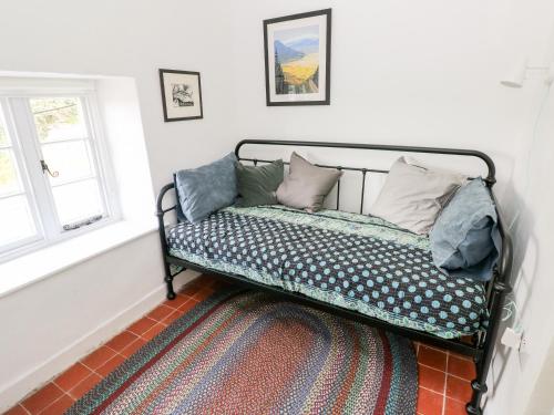 a bed with pillows on it in a room at 10 Westgate Hill in Pembroke