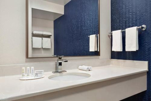 a bathroom with a sink and a mirror at Fairfield Inn & Suites by Marriott Reno Sparks in Sparks