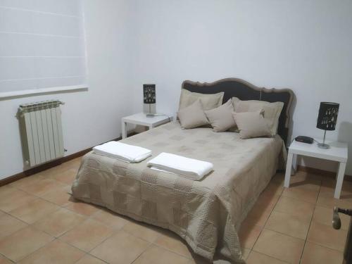 a bedroom with a bed with two books on it at Querido, Vamos de Férias! in Vagos