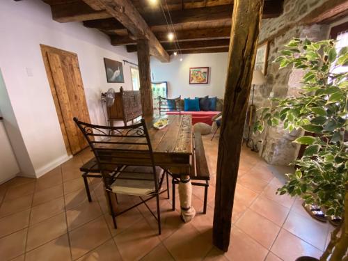 a dining room with a wooden table and chairs at Casa Contovello in Trieste
