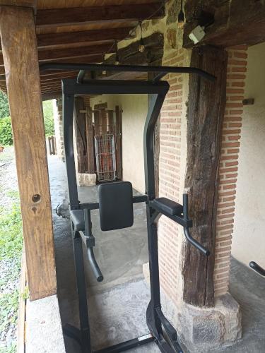 a gym with a mirror in a brick wall at Gorosarri in Escoriaza