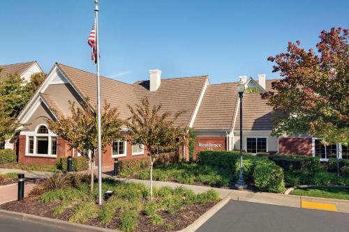 a building with an american flag in front of it at Residence Inn Sacramento Folsom in Folsom