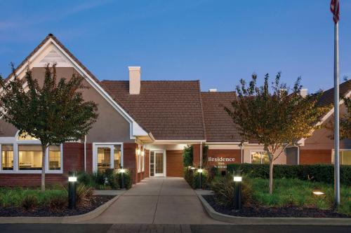 a house with lights in front of a building at Residence Inn Sacramento Folsom in Folsom