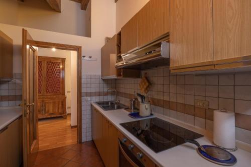 a kitchen with a sink and a counter top at Casa Marmarole in Borca di Cadore