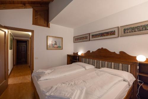 a bedroom with two beds in a room at Casa Marmarole in Borca di Cadore