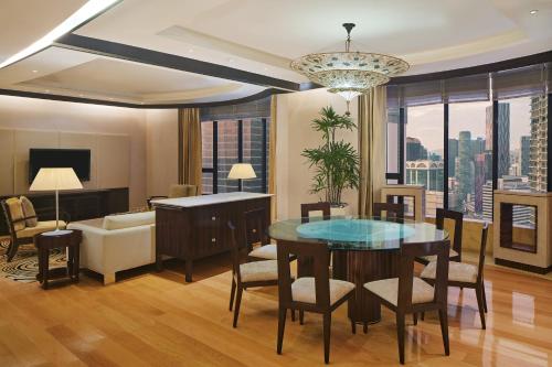 a living room with a table and a couch at The Westin Kuala Lumpur in Kuala Lumpur