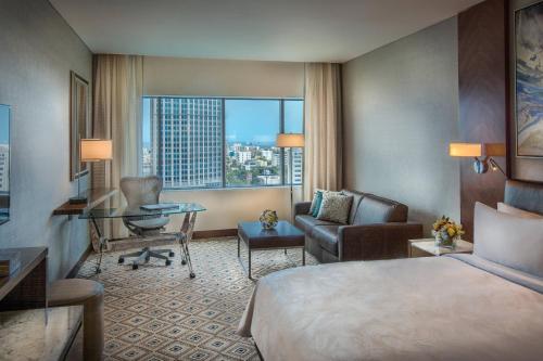 a hotel room with a bed and a desk at JW Marriott Hotel Santo Domingo in Santo Domingo