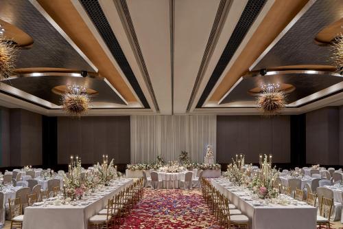 a banquet hall with white tables and chairs at The Westin Kuala Lumpur in Kuala Lumpur