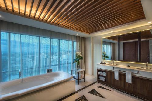 a bathroom with a tub and a large window at JW Marriott Hotel Santo Domingo in Santo Domingo