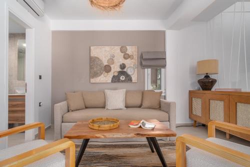a living room with a couch and a table at Utopia Eco Retreat in Skiathos Town