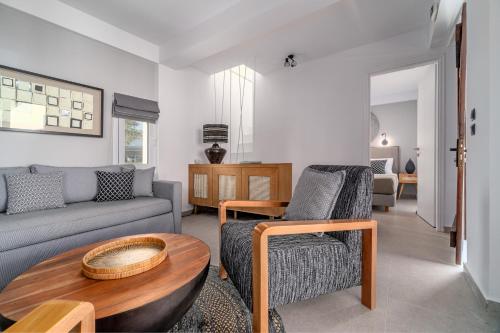 a living room with a couch and a table at Utopia Eco Retreat in Skiathos Town
