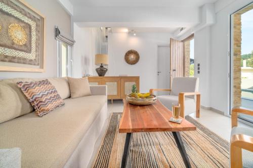 a living room with a couch and a table at Utopia Eco Retreat in Skiathos Town