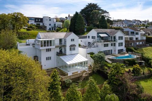 an aerial view of a large white house at Luxury House, SeaViews, En-Suites & Private Pool in Saundersfoot