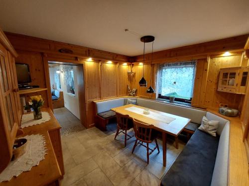 a living room with a table and a couch at Wagnerhof in Pichl bei Aussee