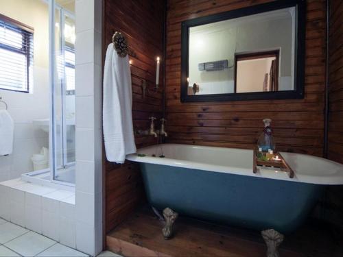 Ett badrum på Harfield Guest Villa