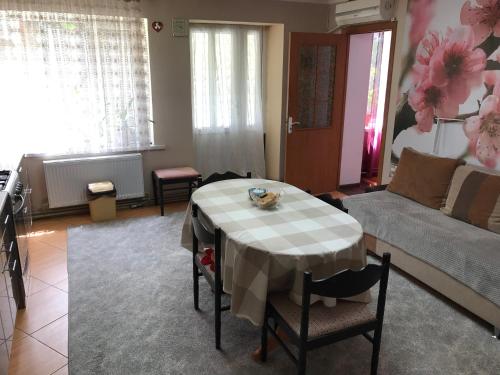 a living room with a table and a couch at House of Grace in Reni